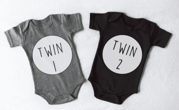 Two onesies with Twin 1 and Twin 2 on the front