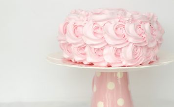 Pink birthday cake on stand