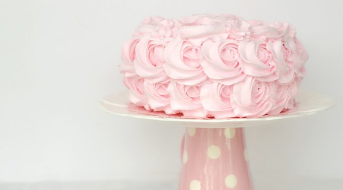 Pink birthday cake on stand