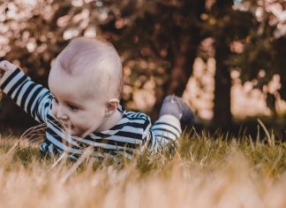 Baby in grass camping