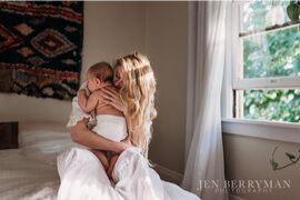 Photo of mother holding a baby by Jen Berryman Photography for the Portland Mom and Baby Guide