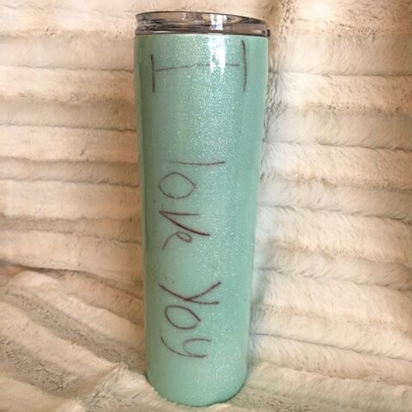 Image of a teal tumbler with "I love you" in a child's handwriting for Mother's Day