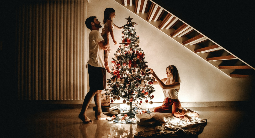 decorating the tree for christmas photos