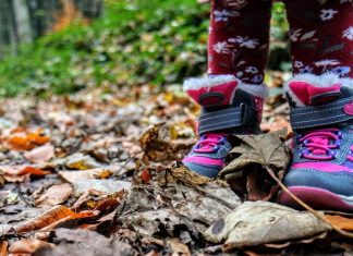 Kid shoes in leaves