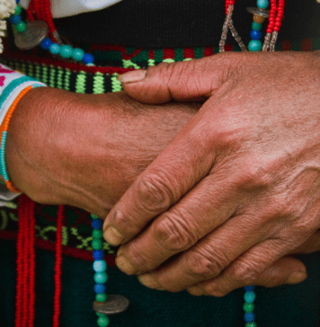 up close image of the hands an older Indigenous woman