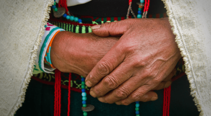 up close image of the hands an older Indigenous woman