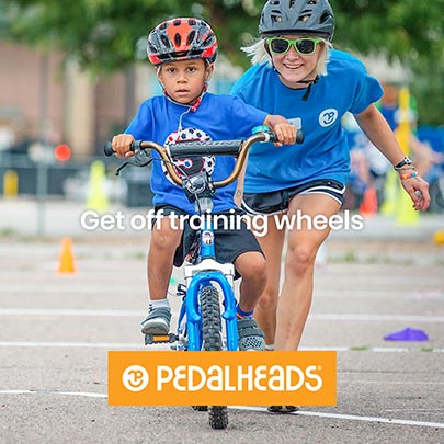 A young kid gets off training wheels at a Pedalheads camp.