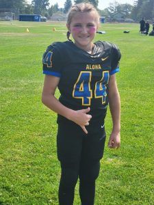 Lexi McCullah in uniform before her tackle football tournament.