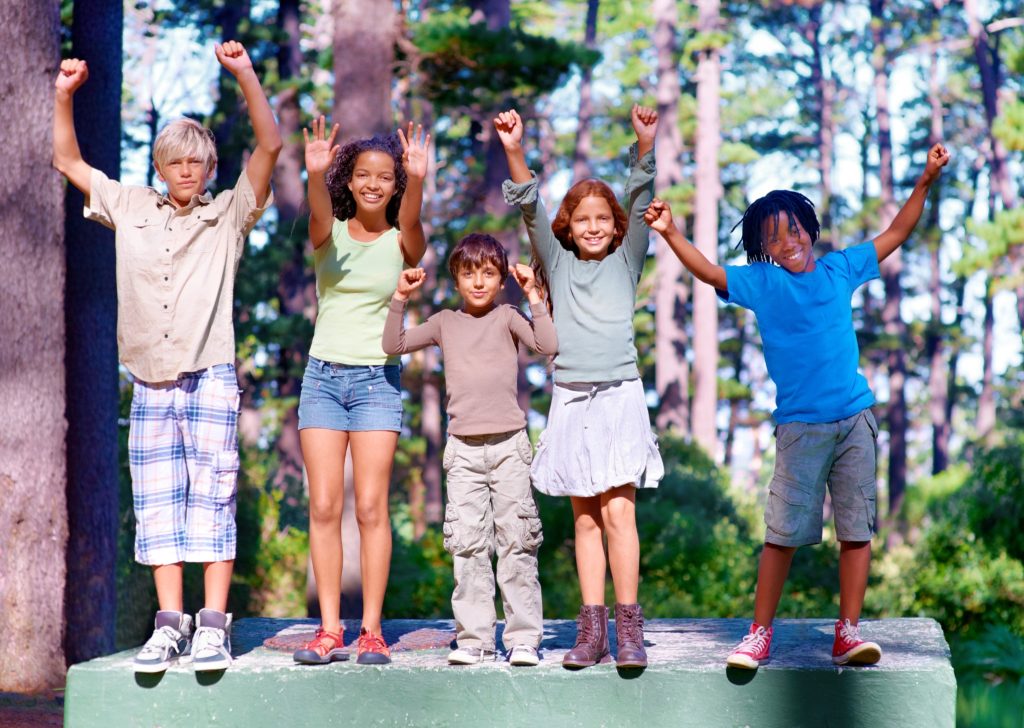 Image of kids playing outdoors in the summer.
