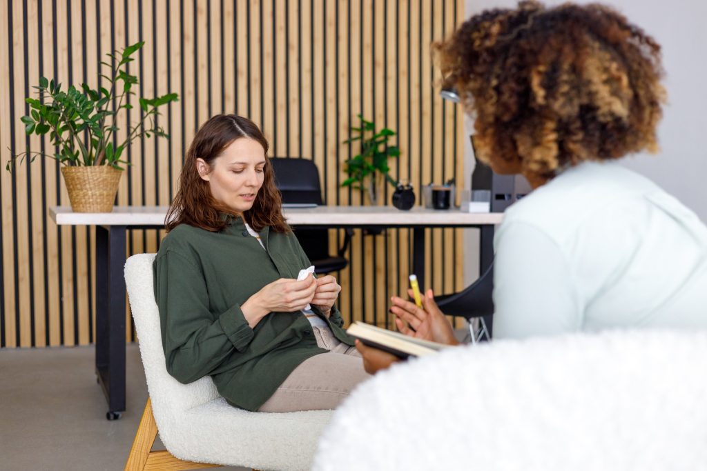 Image of woman talking with a counselor.